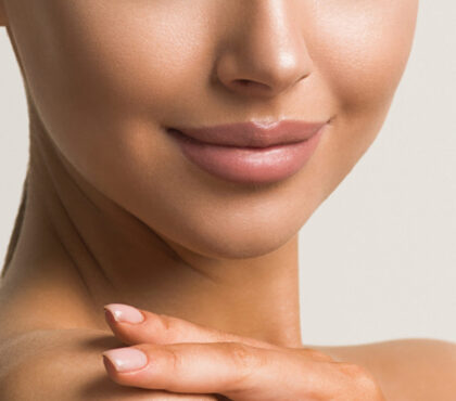 Genioplasty (chin augmentation): a photo of a young woman after the intervention.