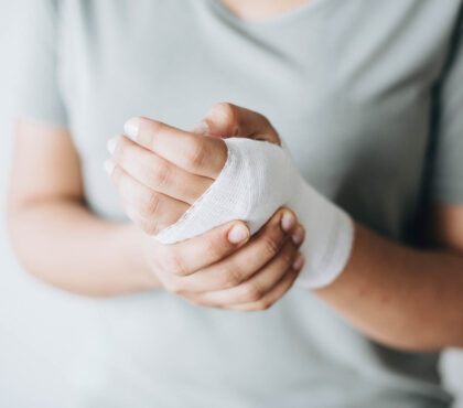 Woman with gauze bandage wrapped around her hand